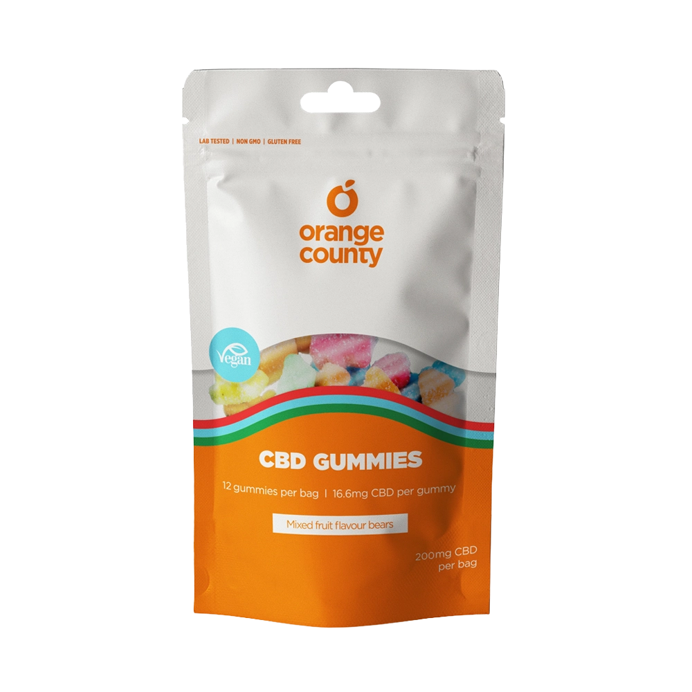 A stand-up pouch of Orange County CBD Gummies on a plain white background. The packaging is white on the top half and bright orange on the bottom, with a clear window showing multicolored gummies inside.