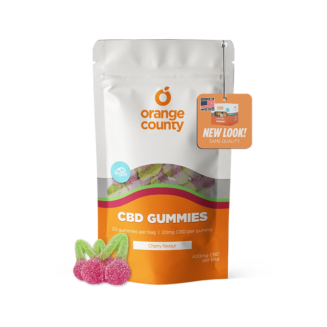 Orange County CBD Gummies in a white and orange stand-up pouch with three cherry-shaped gummies displayed in front on a white background.