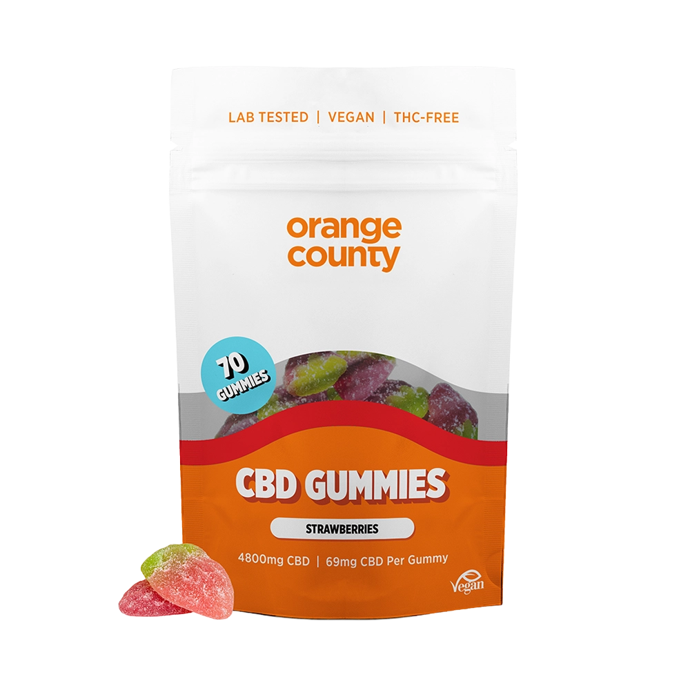 A stand-up pouch of Orange County CBD Gummies, Strawberry flavor, on a plain white background. The packaging is white and orange with a clear window showing multicolored gummies inside.