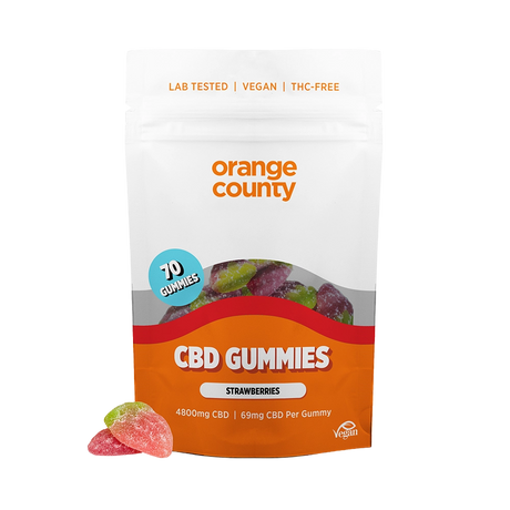 A stand-up pouch of Orange County CBD Gummies, Strawberry flavor, on a plain white background. The packaging is white and orange with a clear window showing multicolored gummies inside.