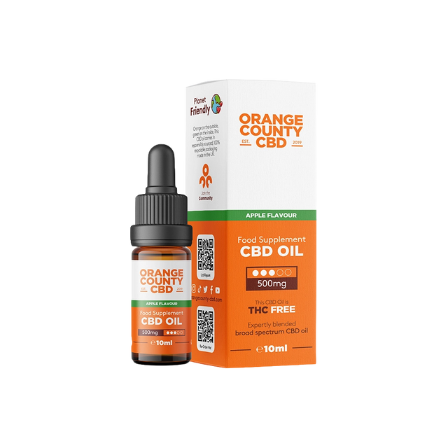A 10ml bottle of Orange County CBD Oil with a black dropper cap stands next to its white and orange retail box on a plain white background. The packaging features the brand 'Orange County CBD' with 'Apple Flavour' and '500mg' highlighted.