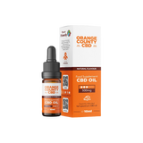 An amber glass dropper bottle of Orange County CBD Oil next to its white and orange retail box, featuring the brand name 'Orange County CBD' on a clean white background.
