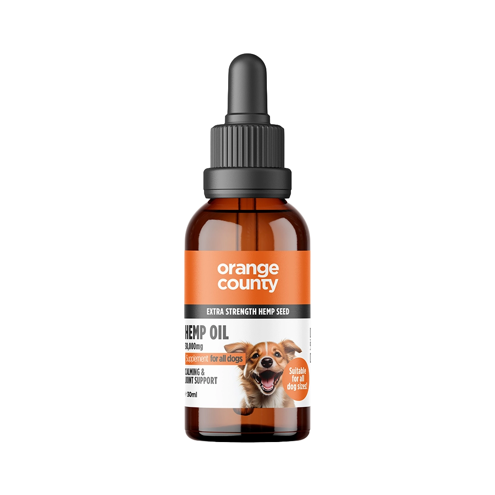 An amber glass dropper bottle of Orange County Hemp Oil for dogs, featuring a black dropper cap and a label with orange and white sections and a dog illustration, set against a plain white background.