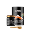 Orange County Himalayan Shilajit Pure Shilajit Resin shown with a black cylindrical container, a small black jar with a gold lid, and a gold spoon on a white background.
