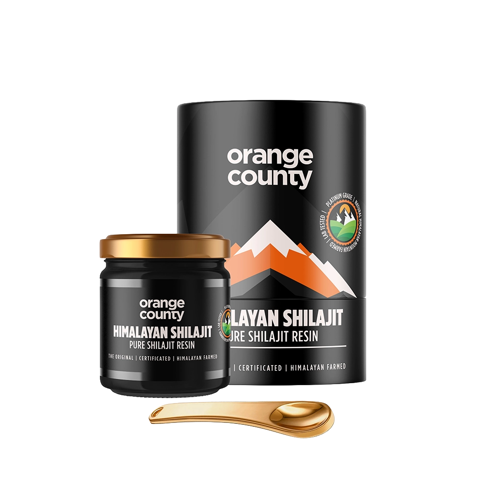 Orange County Himalayan Shilajit Pure Shilajit Resin shown with a black cylindrical container, a small black jar with a gold lid, and a gold spoon on a white background.