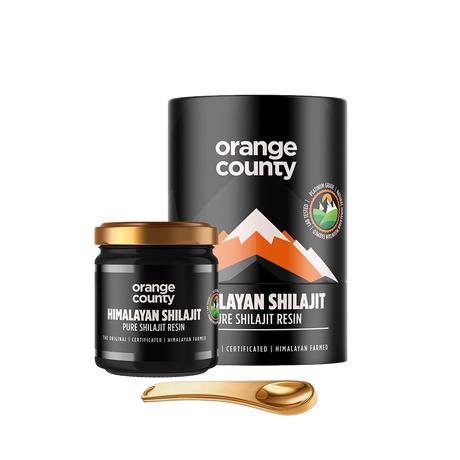 Orange County Himalayan Shilajit Pure Shilajit Resin shown with a black cylindrical container, a small black jar with a gold lid, and a gold spoon on a white background.