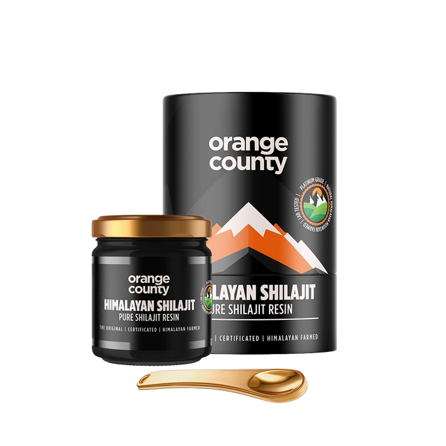 Orange County Himalayan Shilajit Pure Shilajit Resin shown with a black cylindrical container, a small black jar with a gold lid, and a gold spoon on a white background.