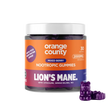 A jar of Orange County Lion's Mane Nootropic Gummies with a white lid and an orange, purple, and blue label, shown on a white background with three purple gummy bears in front.