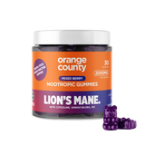 A jar of Orange County Lion's Mane Nootropic Gummies with a white lid and an orange, purple, and blue label, shown on a white background with three purple gummy bears in front.